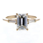 Emerald Cut Diamond Engagement Ring in Three Stone Setting with Tapered Baguettes