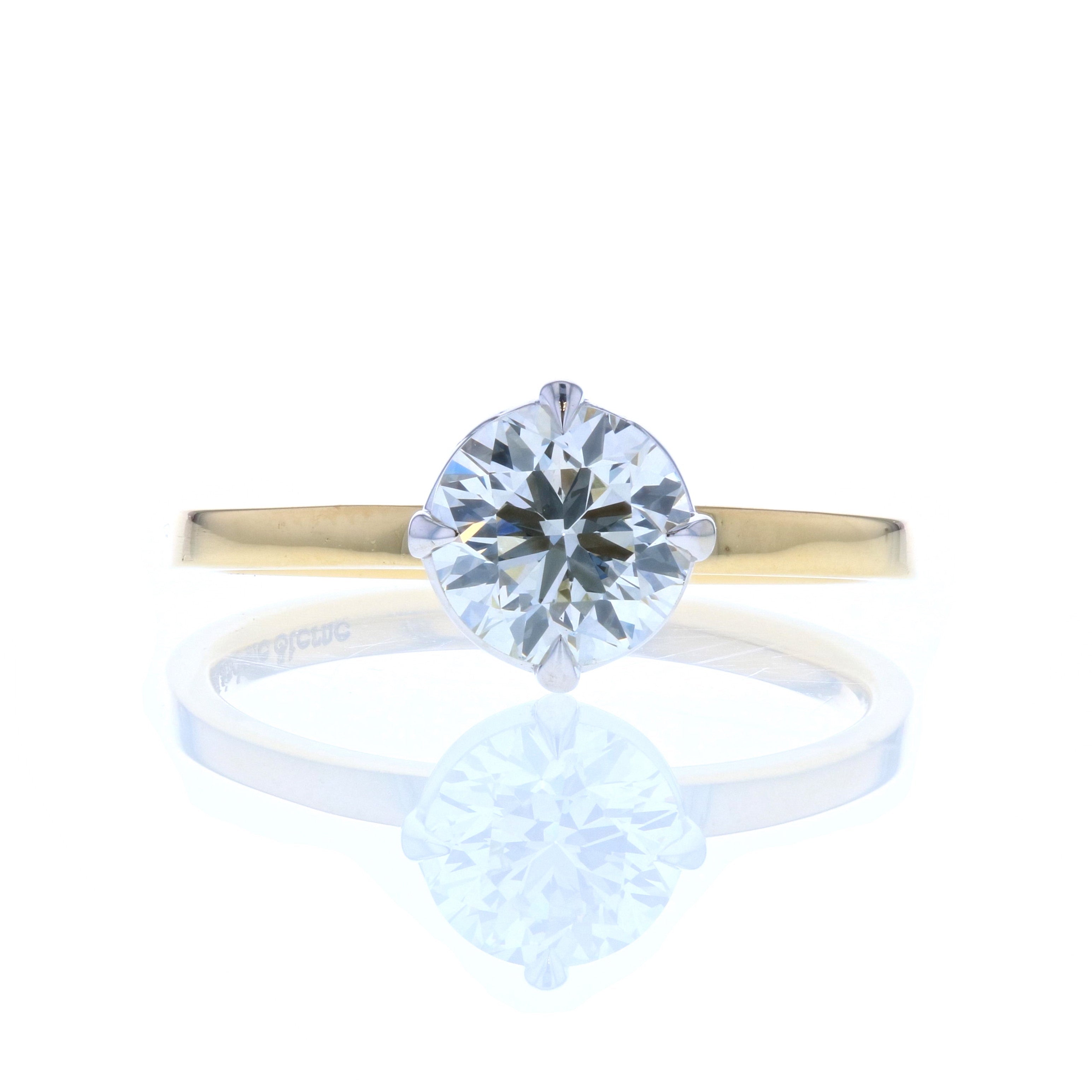 Round Cut Solitaire Diamond Engagement ring in White and Yellow Gold